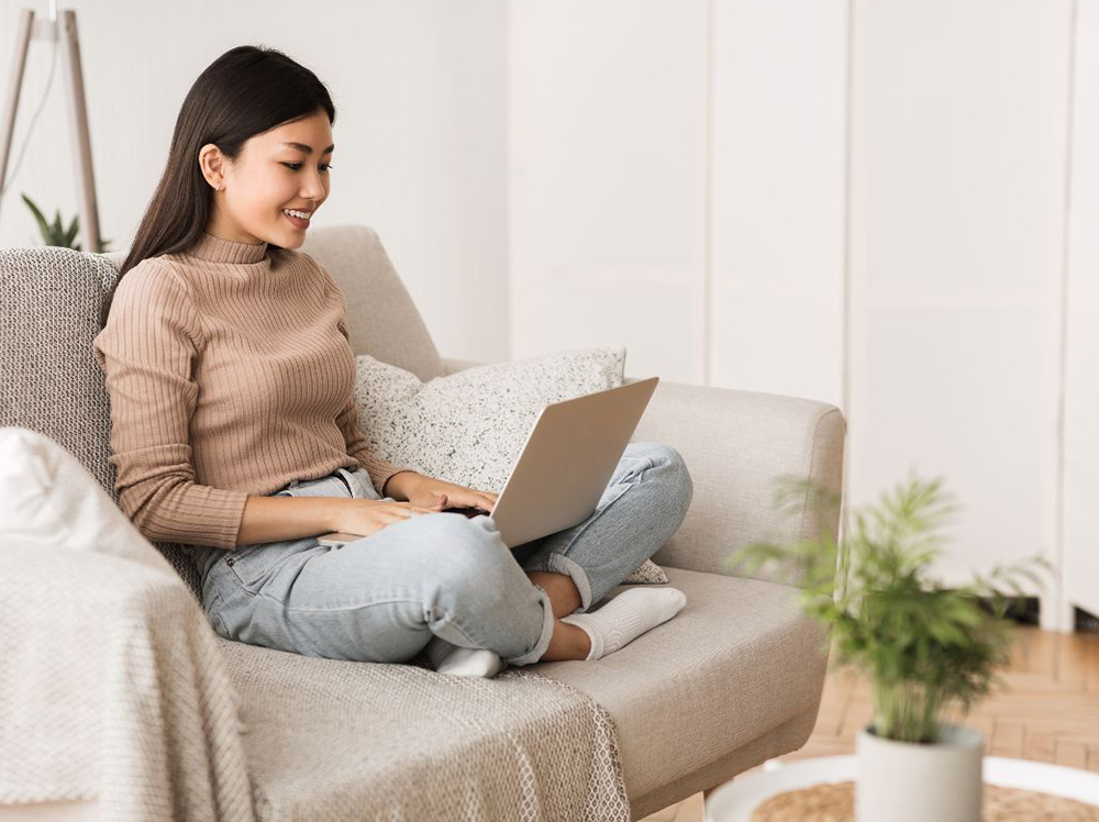Woman smiling at computer